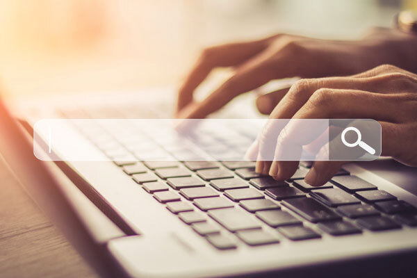 A photo of a hand typing on a keyboard, used for 5 Top Security Best Practices for Protecting Government Records